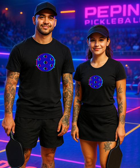 Two people wearing black t-shirts with a pickleball design on a court with 'Pepin Pickleball' branding.