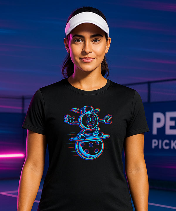 Person wearing a black t-shirt with a blue graphic design on a tennis court at night.
