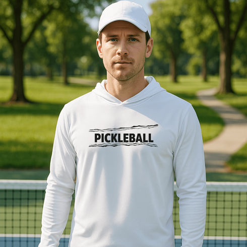 Man wearing a white hoodie with 'Pickleball' text on a tennis court