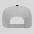 Gray cap with a black button on a light gray background